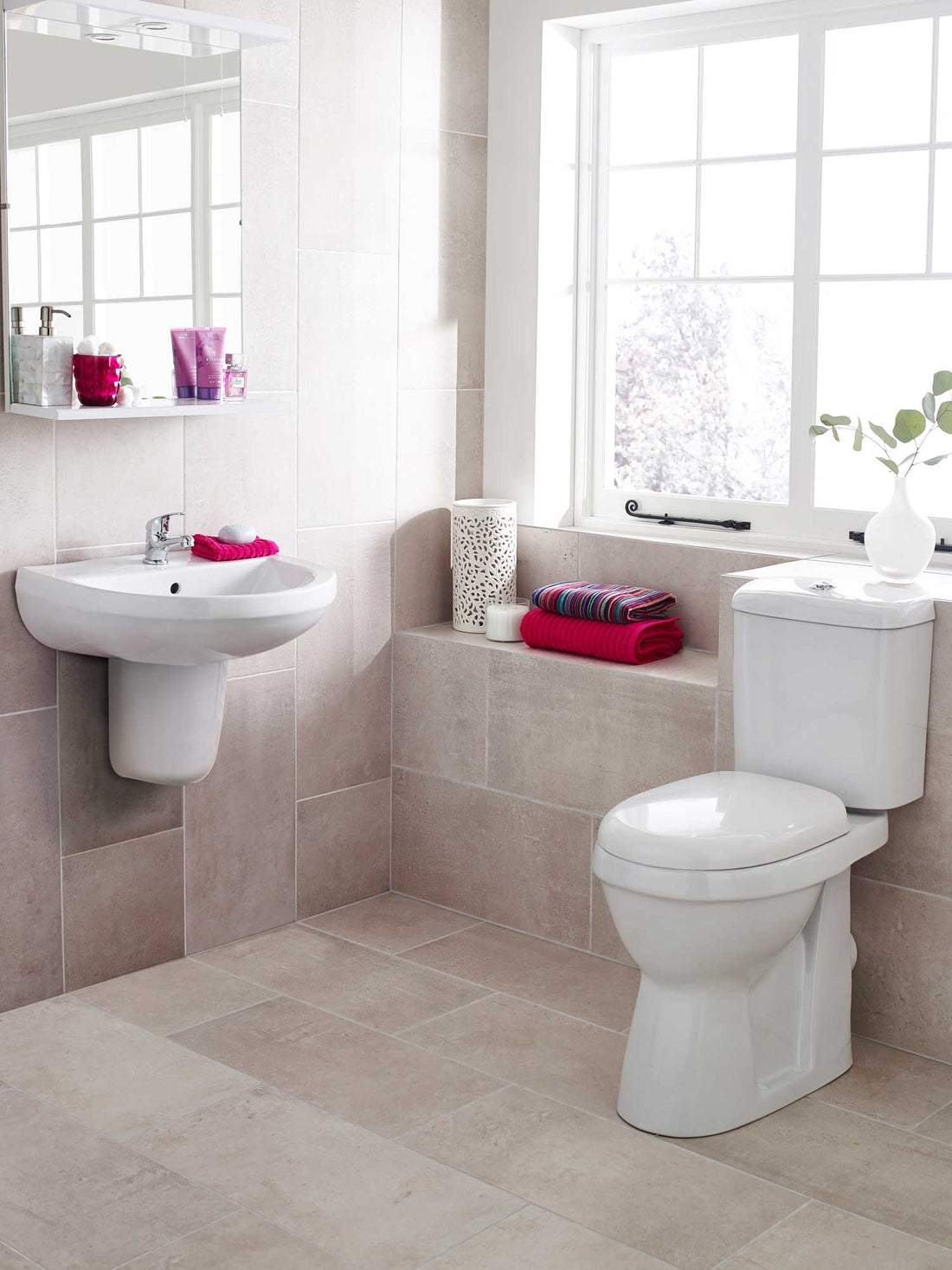 Close coupled comfort height WC pan with cistern and seat, Tuskan Tiles Nuie Doc-M Pack in white, 380x650mm.