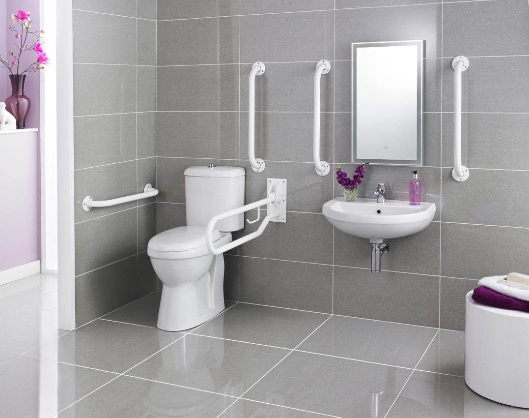 Nuie Doc-M white basin and toilet pack with grab bar and rails, featuring a modern bathroom setup with accessible fixtures.
