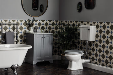 Tuskan Tiles Bayswater Fitzroy comfort height WC pan with open back and low level cistern, measuring 474x515mm, shown with open lid.