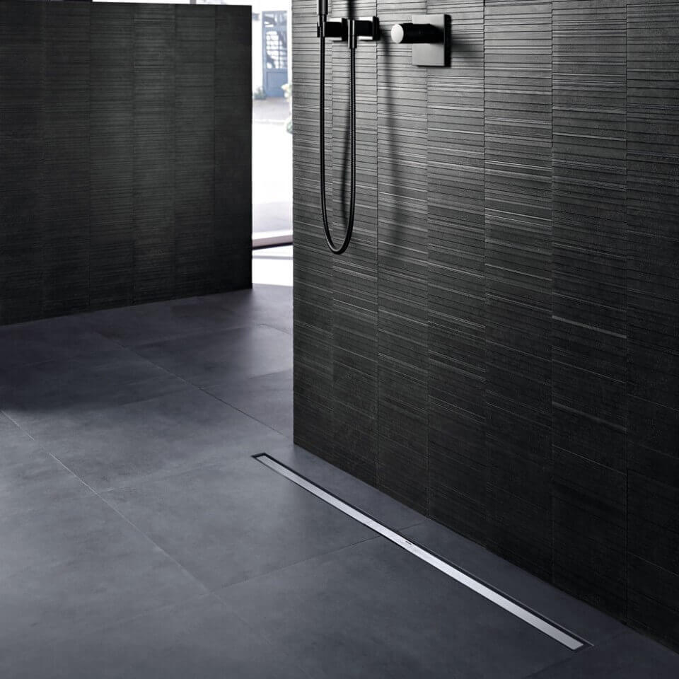 Linear shower drain from Geberit CleanLine60 series, installed in a modern bathroom with sleek design and polished finish.