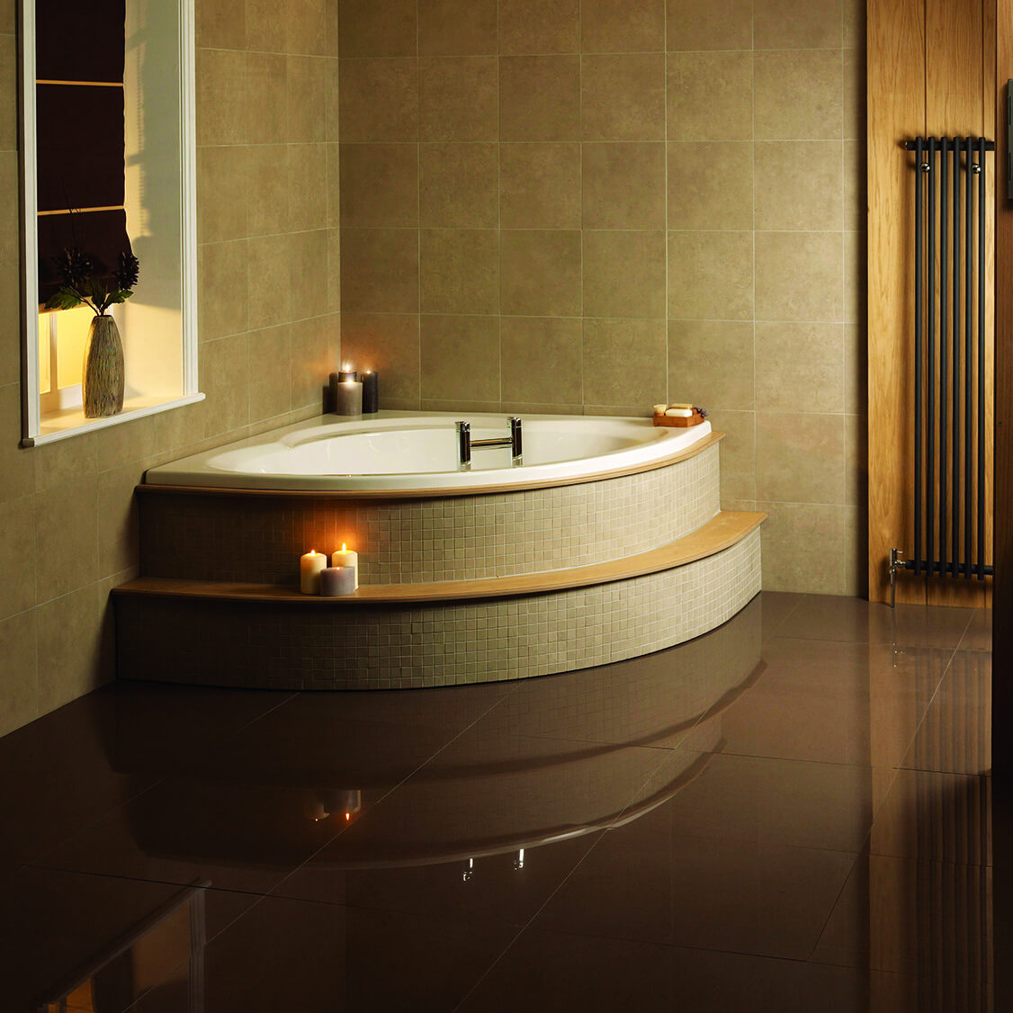 White acrylic corner bath by Tuskan Tiles, Aqua Lagoon Space Saver design, 1200 x 1200mm, shown in a modern bathroom setting.