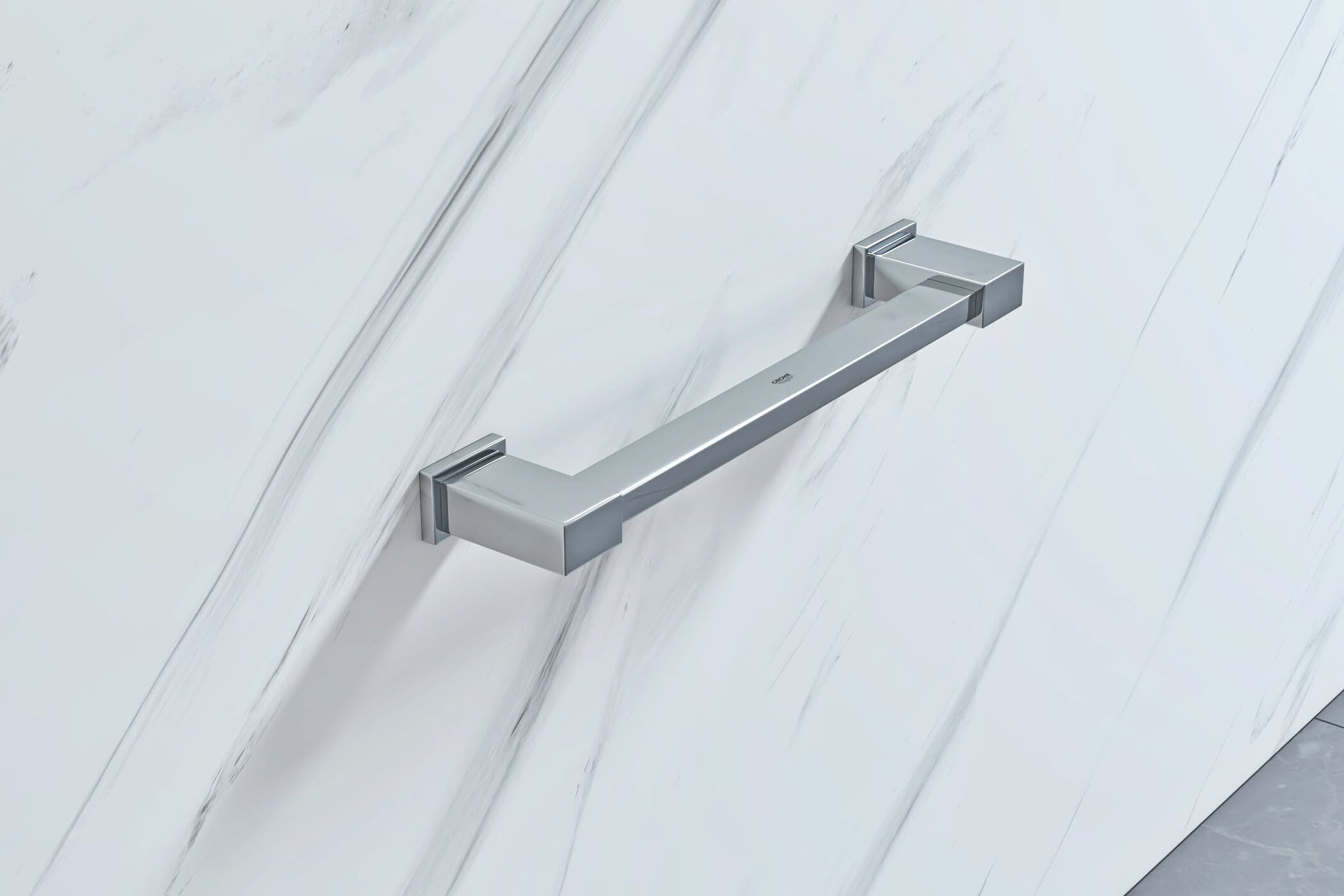 Chrome finish Grohe Essentials Cube contemporary grab bar from Tuskan Tiles, measuring 340 x 81mm, mounted on a bathroom wall.