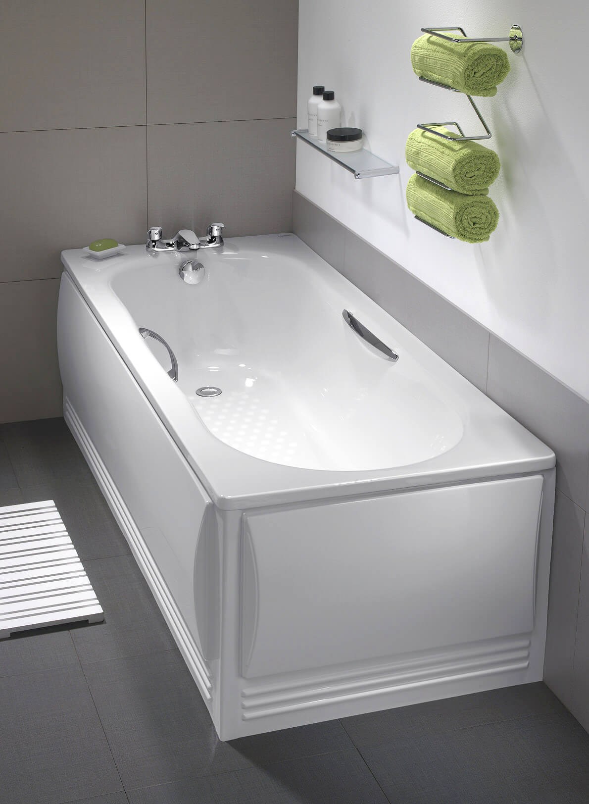 White single-ended steel bath with legs and grips, designed for comfort and stability, showcasing a sleek, modern bathroom fixture.