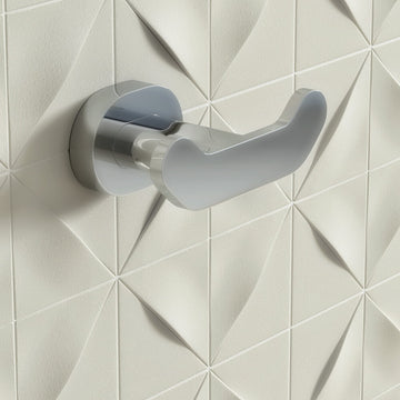 Contemporary chrome double wall hook from Vado Life by Tuskan Tiles, mounted on a wall for bathroom or entryway use.