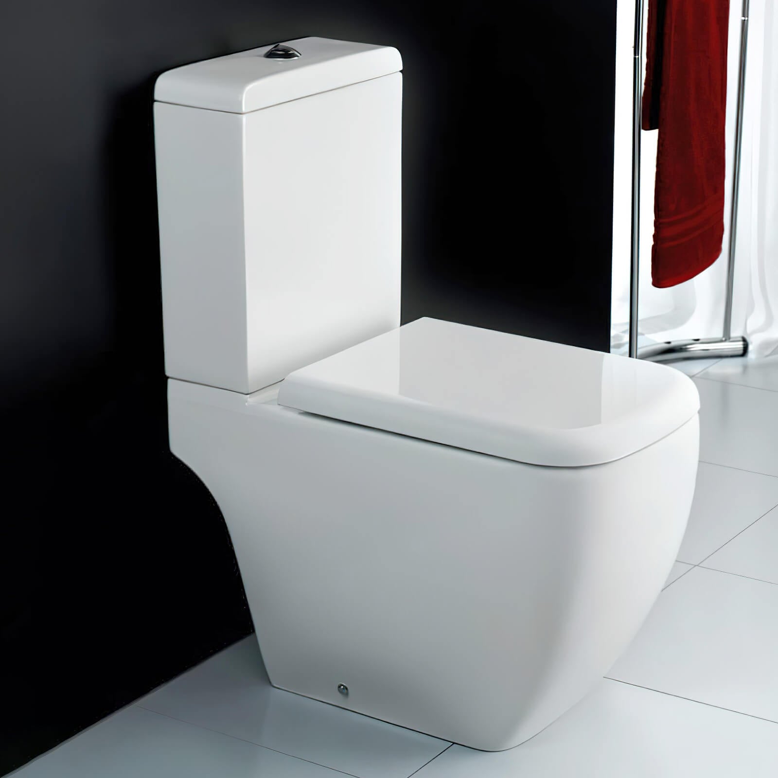 White compact cloakroom suite by Tuskan Tiles featuring modern design, with a toilet, sink, and storage cabinet in a sleek bathroom setting.