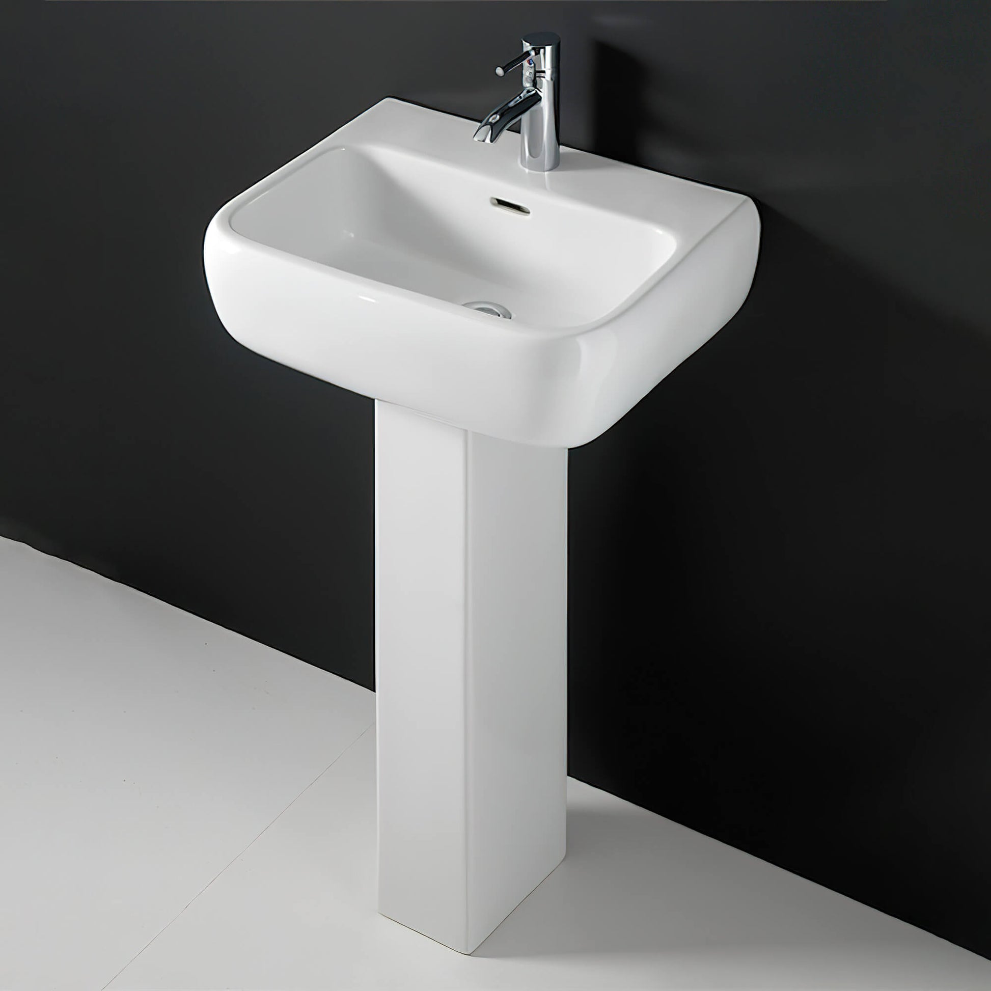 White compact cloakroom suite by Tuskan Tiles featuring a modern design, includes a toilet and sink setup for small bathrooms.