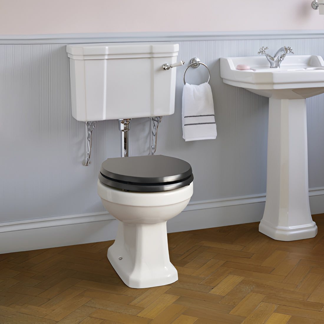 Ideal Standard Waverly low level white WC pan with cistern, traditional design, 520x645mm, shown in a bathroom setting
