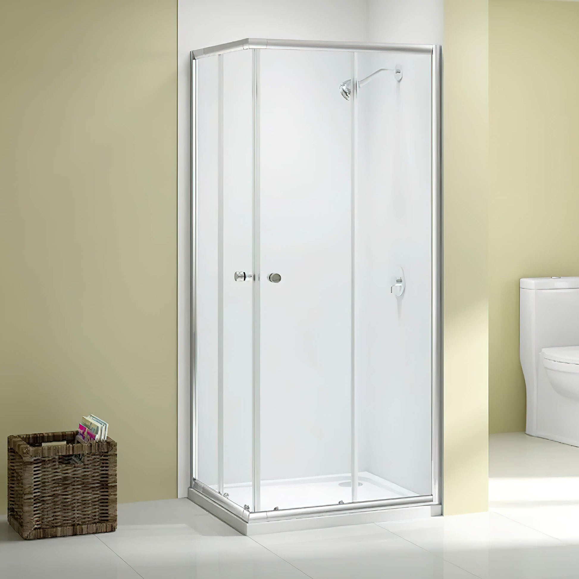 Merlyn Ionic Source corner entry double sliding shower door cubicle, 900x900mm, with clear glass panels and chrome framing.
