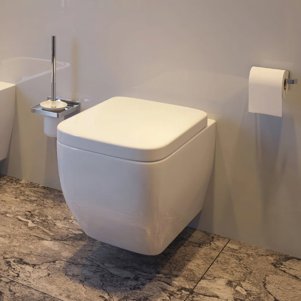 Square wall-mounted toilet by IMEX Essence, 355x470mm, with a sleek white ceramic finish and modern design.