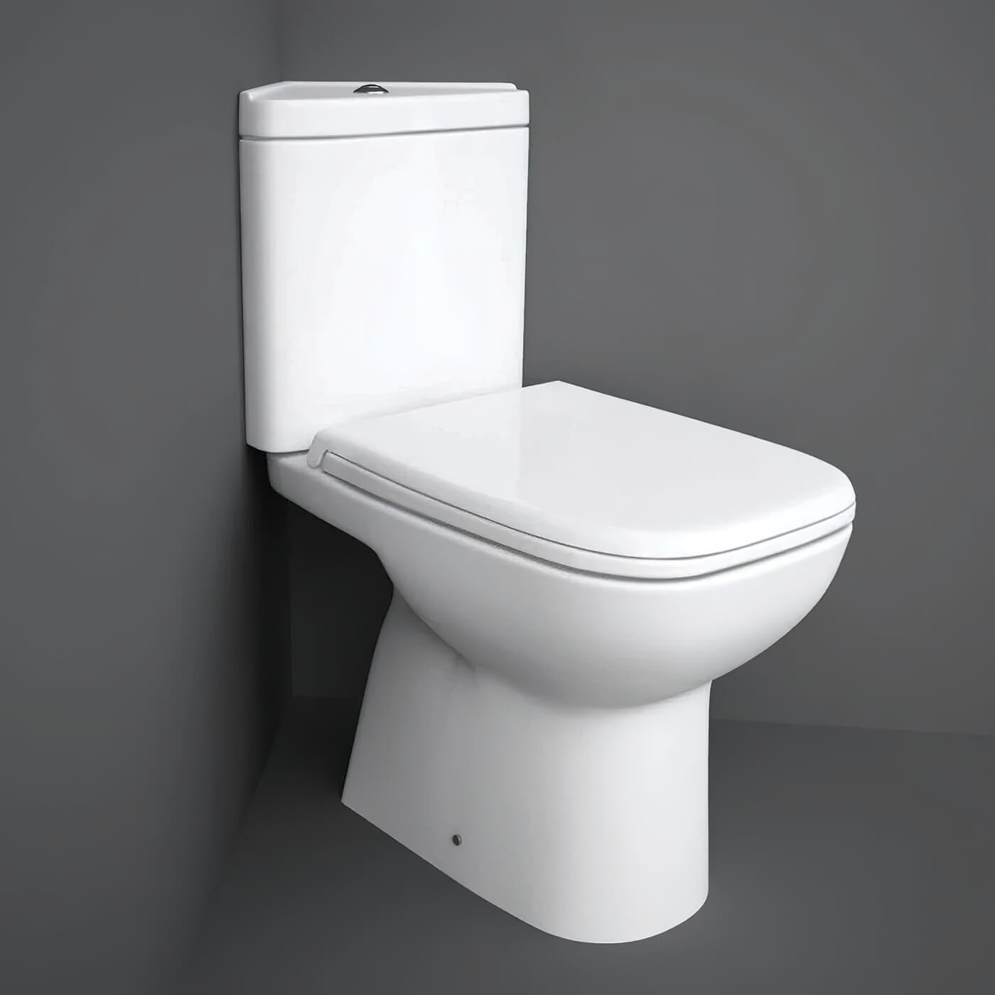 Tuskan Tiles RAK Origin close coupled corner toilet pack with cistern and soft close seat, open back, full access design.