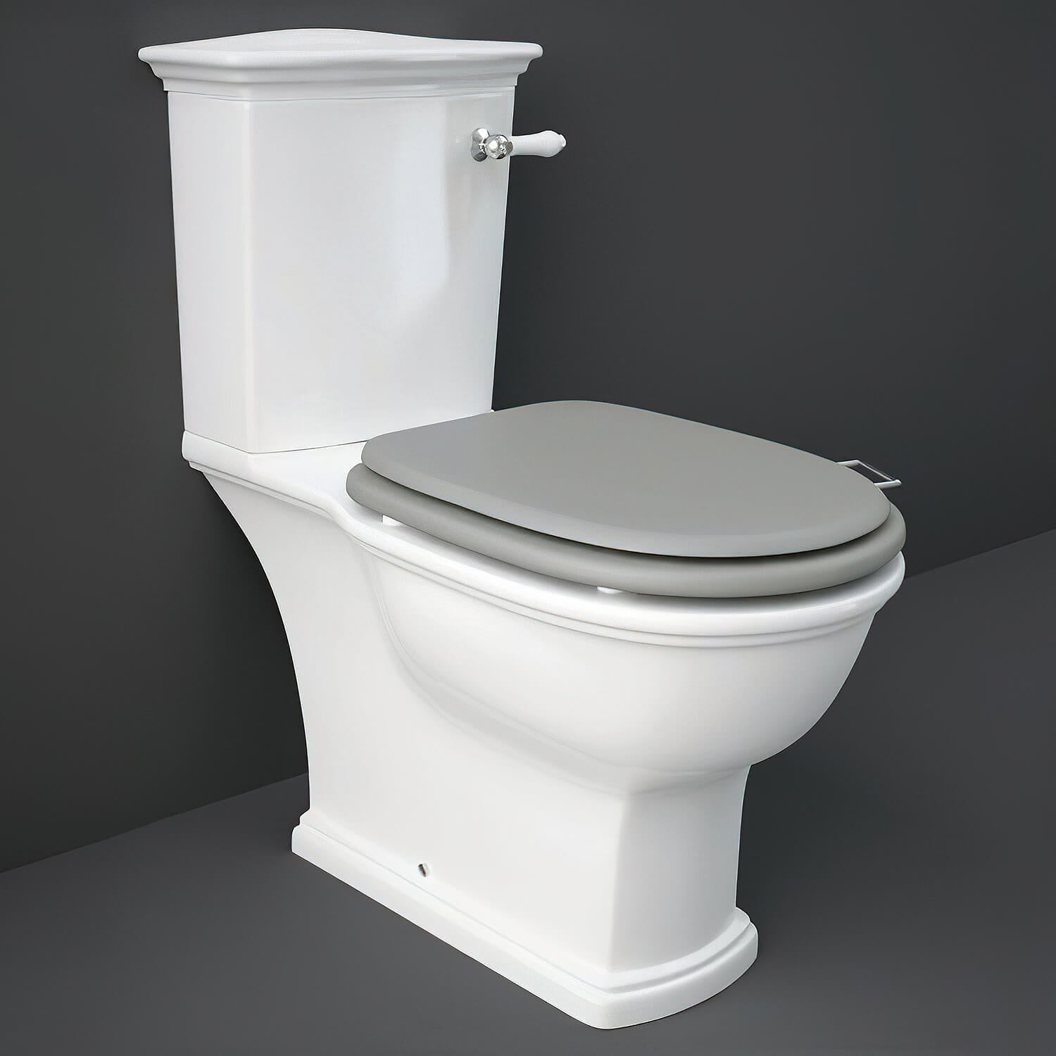 Close coupled WC pan with cistern and soft close wooden seat, RAK Washington model, 360x705mm, in a bathroom setting