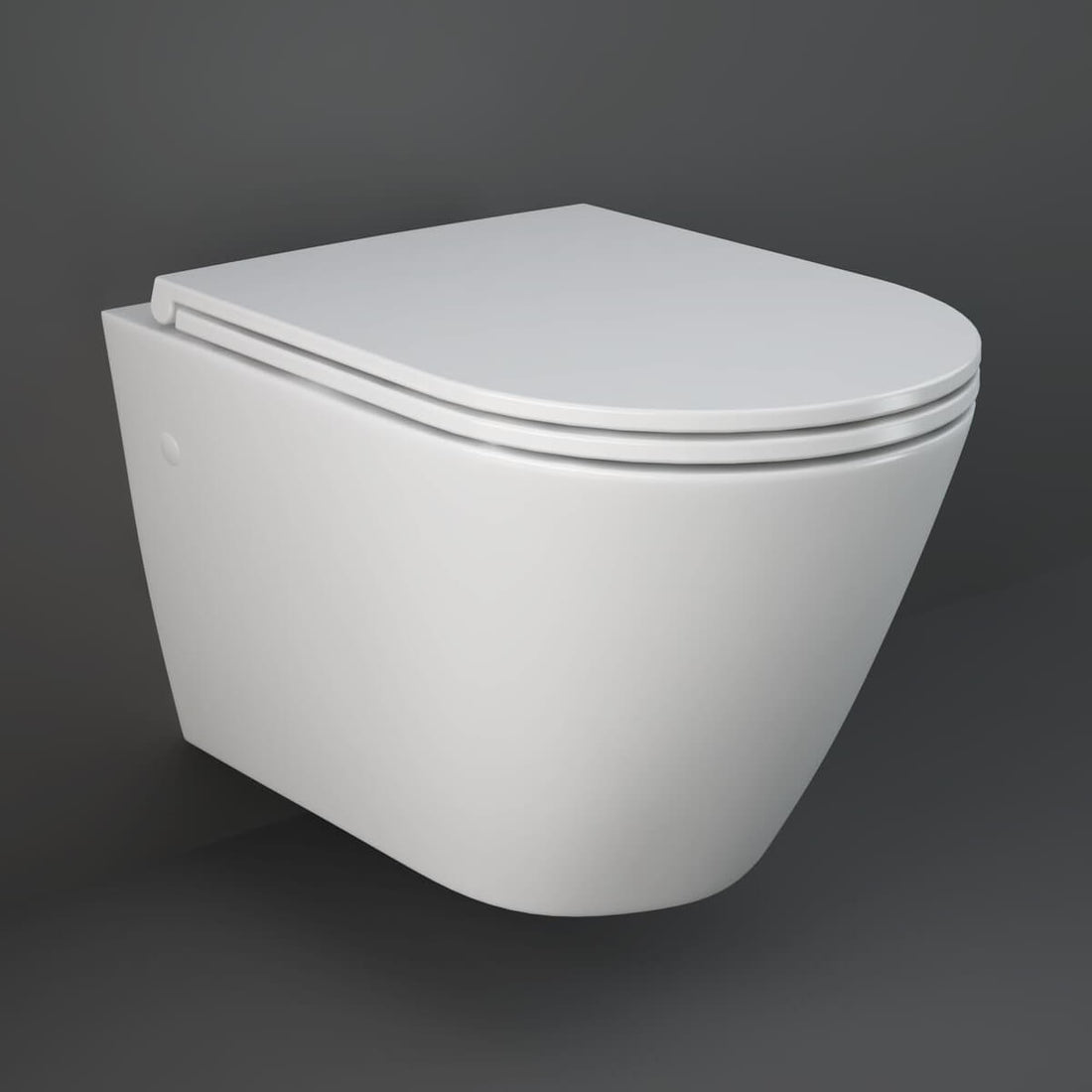 Tuskan Tiles Rak Resort wall hung WC pan with soft close seat, 360x520mm, shown in a modern bathroom setting.