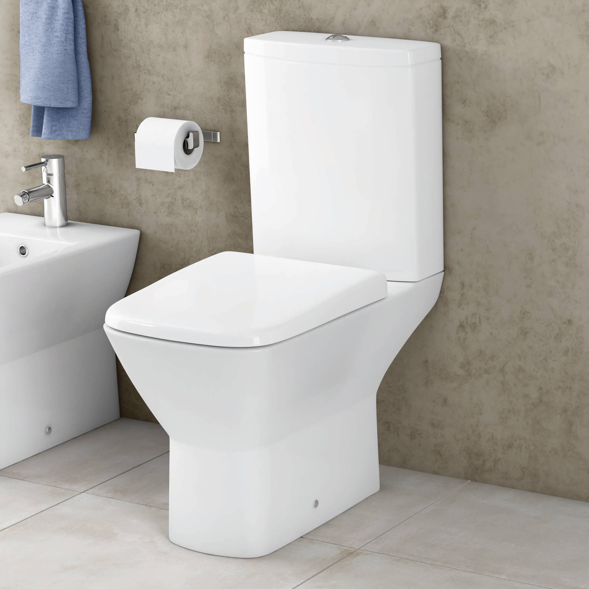 White compact cloakroom suite by Tuskan Tiles featuring a modern toilet and sink combo for small spaces.