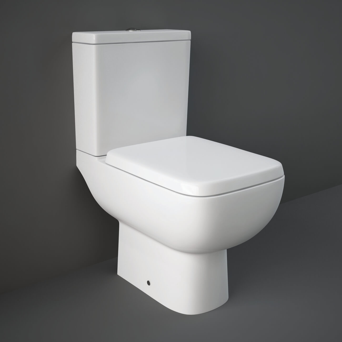 Contemporary RAK Series-600 white cloakroom suite with sleek design, including a toilet and sink, by Tuskan Tiles.
