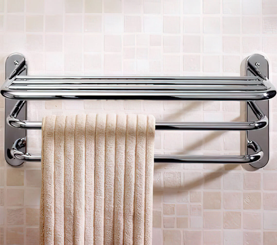 Chrome towel rack with three tiers, 663mm wide, designed for bathroom use, featuring sleek metal finish and sturdy construction.
