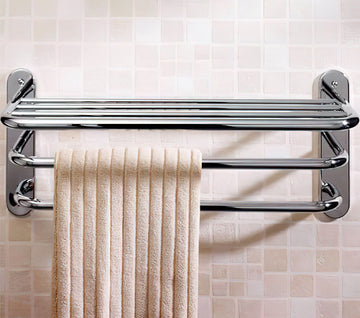 Chrome towel rack with three tiers, 663mm wide, designed for bathroom use, featuring sleek metal finish and sturdy construction.
