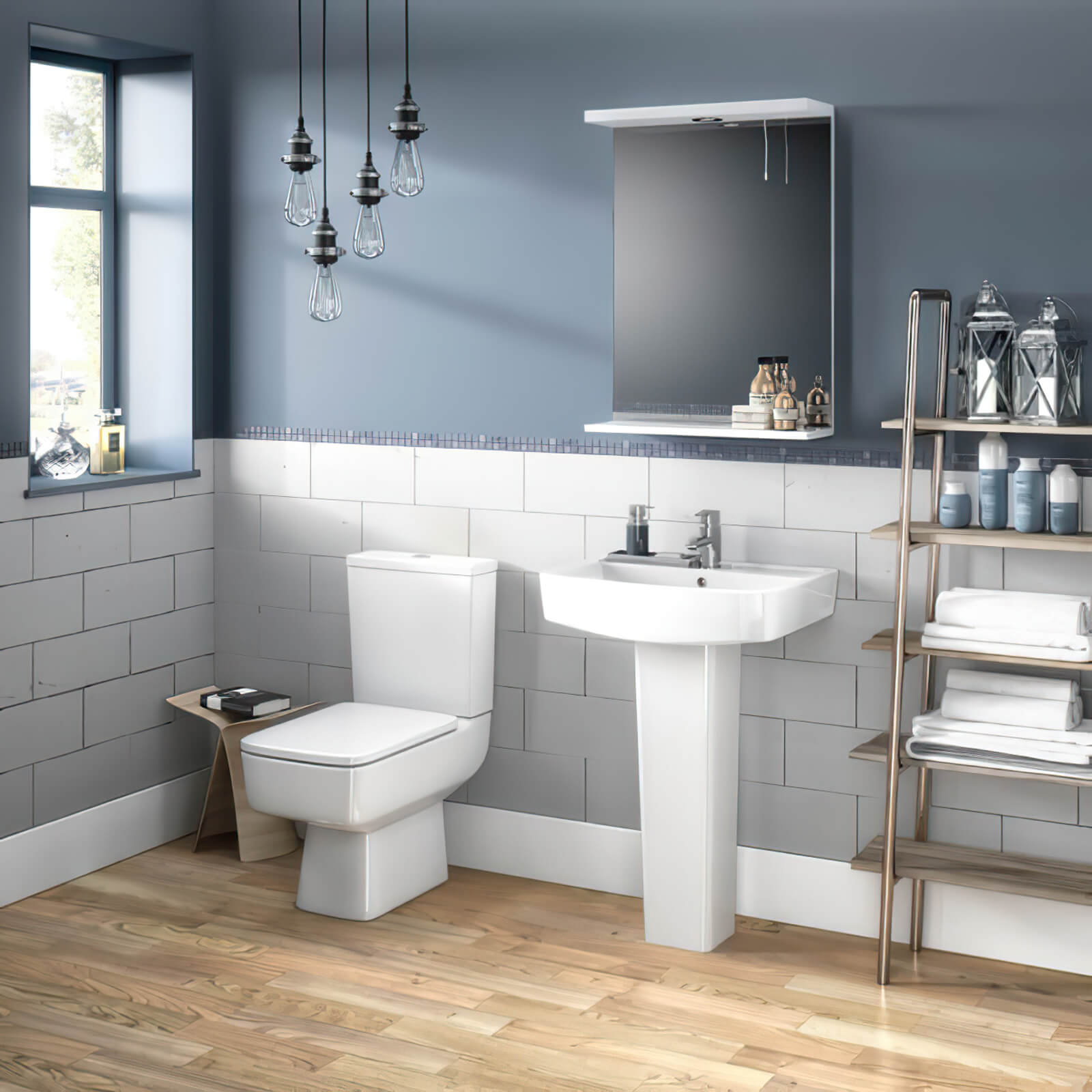 White Nuie Bliss semi-flush wall-mounted WC pan with open back and cistern, measuring 374x610mm, installed in a bathroom setting.