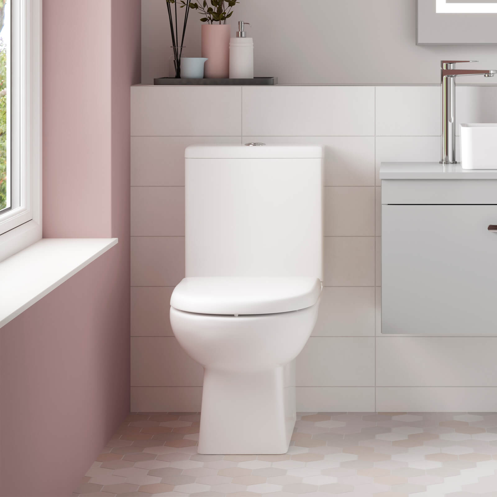 White Nuie Asselby contemporary toilet and basin pack with sleek design, shown in a modern bathroom setting.