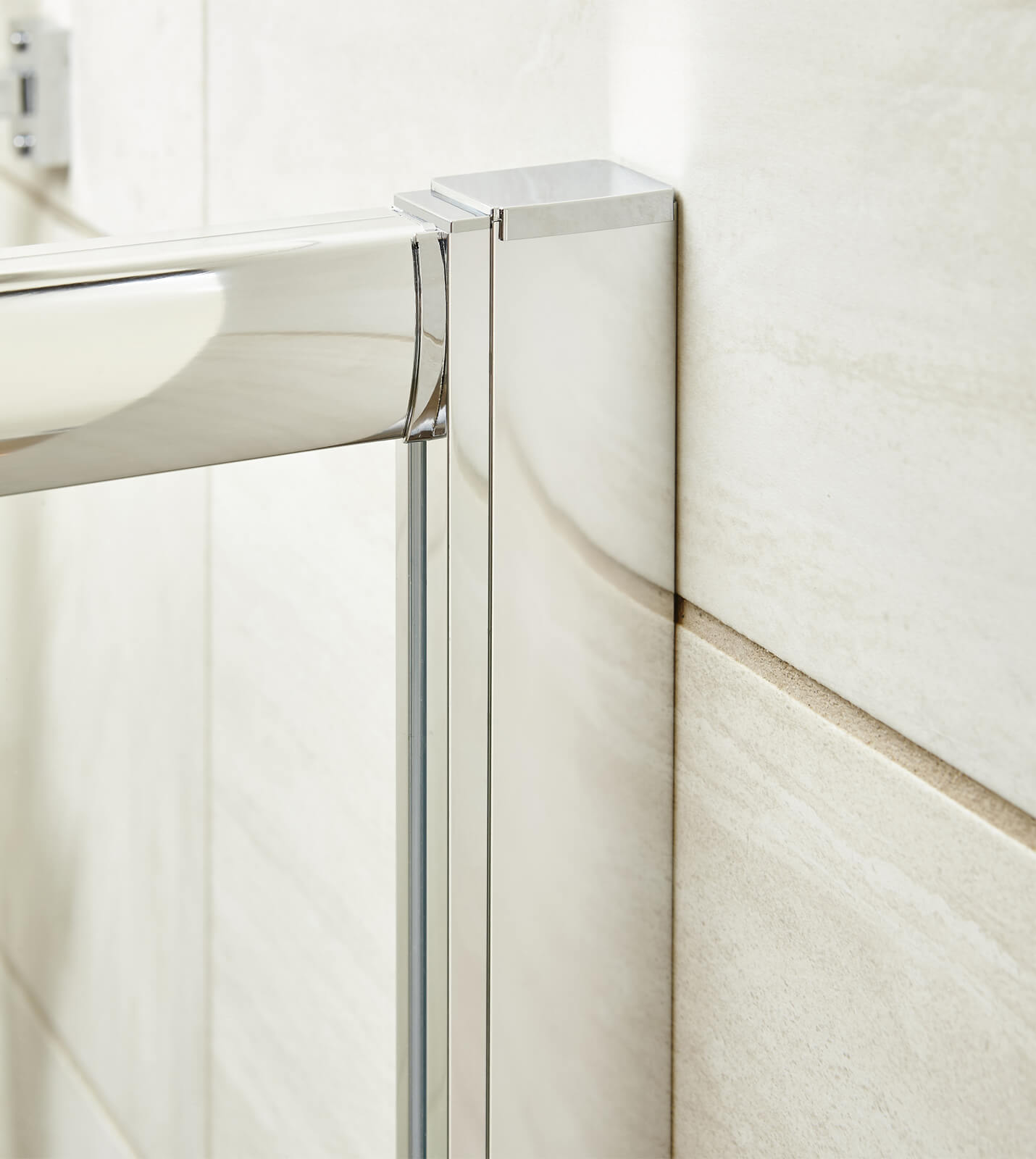 Nuie Pacific sliding quadrant shower enclosure with aluminium frame, reversible design, 860x860mm, installed in a bathroom.