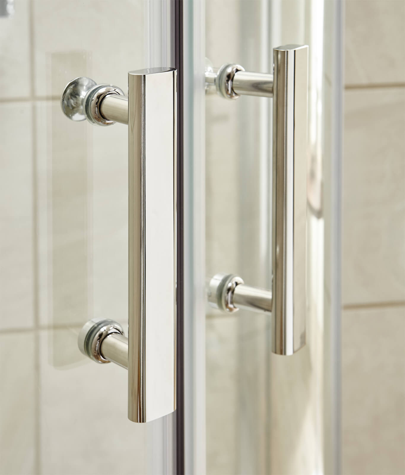 Nuie Pacific sliding quadrant shower enclosure with aluminium frame, reversible design, 860x860mm size, installed in a bathroom.