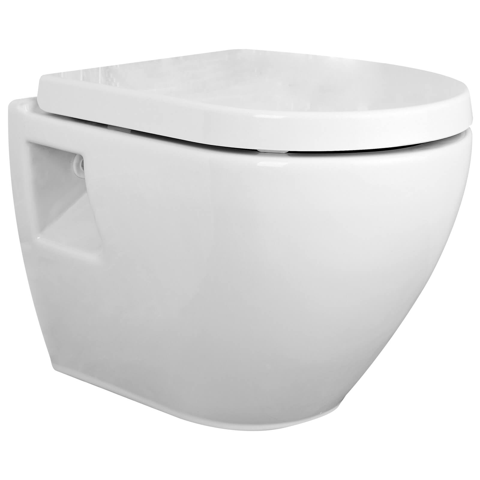 White Nuie Provost round wall-hung WC pan by Tuskan Tiles, 355x510mm, shown installed on bathroom wall.