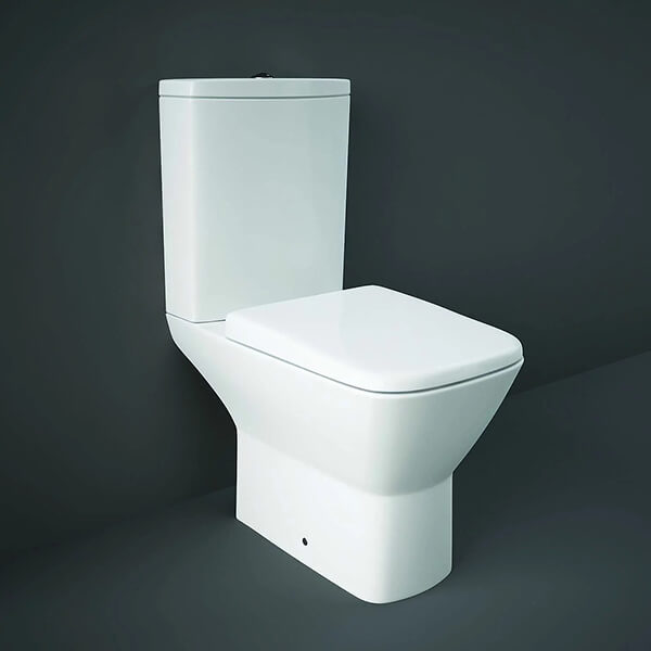 Close coupled white WC with soft close seat and cistern, open back design, 360x650mm, by Tuskan Tiles.