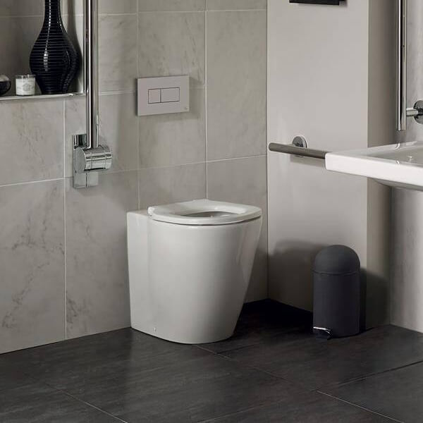 Ideal Standard Concept Freedom white back-to-wall WC pan with raised height, 365x555mm, installed in a modern bathroom setting.