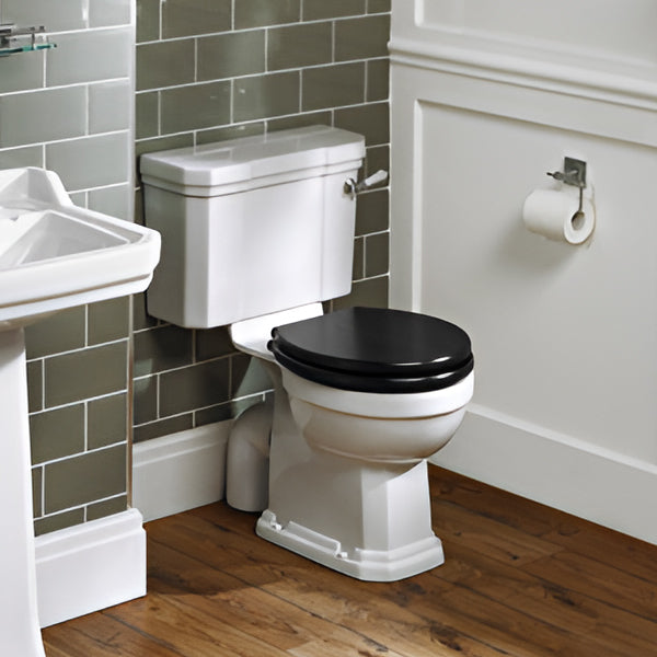 Close coupled traditional toilet with cistern by Ideal Standard Waverly, white ceramic, 520x675mm, shown from side view