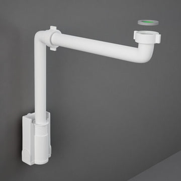 Tuskan Tiles RAK Duo Alpine White plastic bottle trap for vanity, shown in a bathroom setting with clean, modern design.