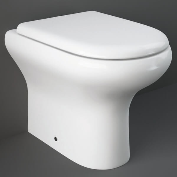 White RAK Compact Back To Wall WC Pan with soft close seat, 370x510mm, installed in modern bathroom by Tuskan Tiles.