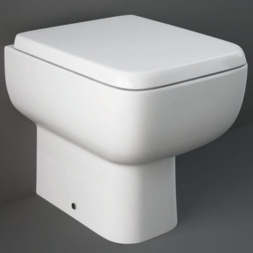 White RAK Series-600 back-to-wall toilet pan with soft-close seat, measuring 350x490mm, from Tuskan Tiles.