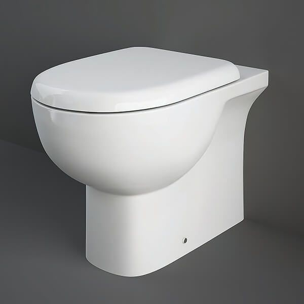 Tuskan Tiles RAK Tonique floorstanding back-to-wall WC pan with soft-close seat, 360x550mm, in a modern bathroom setting