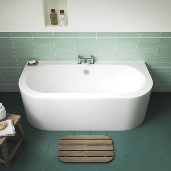 Nuie Shingle White back-to-wall double-ended bath with curved corners, 1700x750mm, featuring a side panel, by Tuskan Tiles.