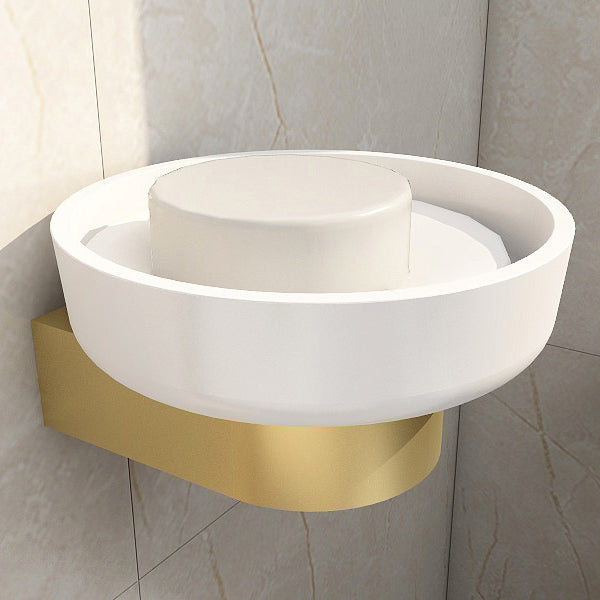 White circular soap dish with wall bracket by Tuskan Tiles, 121mm diameter, mounted on bathroom wall.