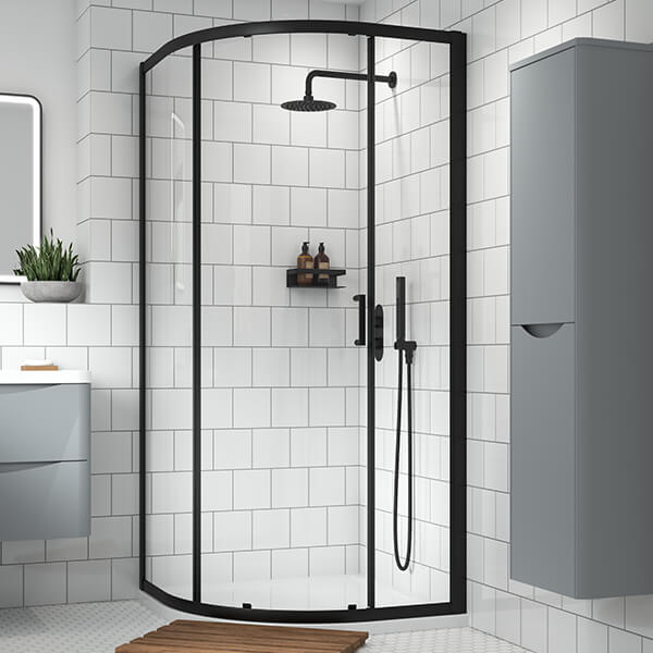 Nuie Lucie sliding door quadrant shower enclosure with aluminium frame, 900 x 900mm, featuring clear glass panels and modern design