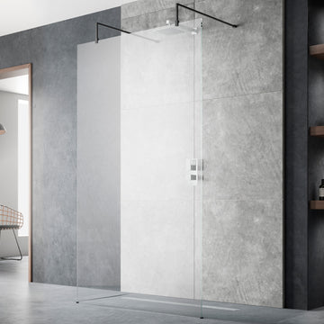 Hudson Reed frameless wetroom shower screen with black support arms and feet, 1950mm high, installed in a modern bathroom.