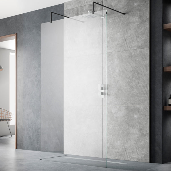 Hudson Reed frameless wetroom shower screen with black support arms and feet, 1950mm high, installed in a modern bathroom.