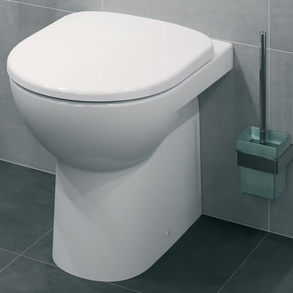 White Geberit Selnova Round Flushwise back-to-wall WC pan, 530mm, installed in a bathroom setting.