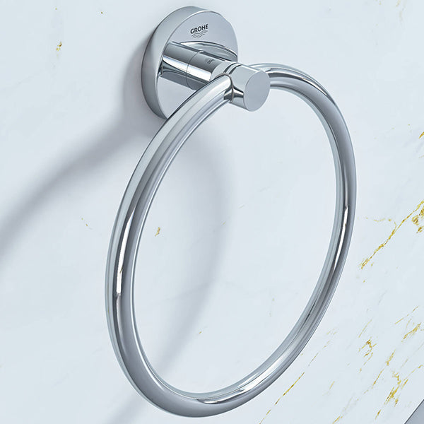 Chrome Grohe Essentials towel ring mounted on bathroom wall, modern design for holding hand towels.