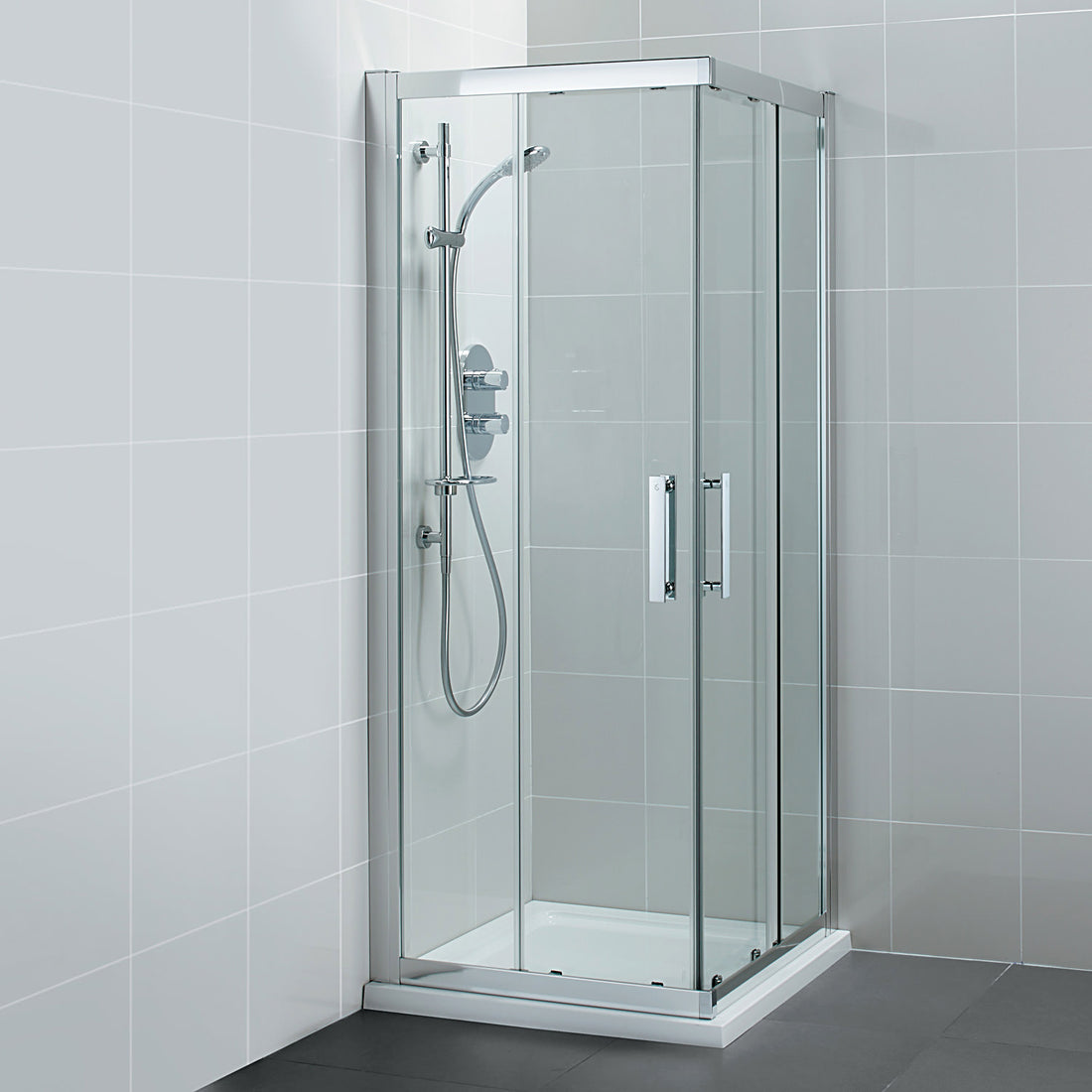 Ideal Standard Synergy sliding corner shower enclosure with two doors and silver frame, measuring 1000 x 1900mm.