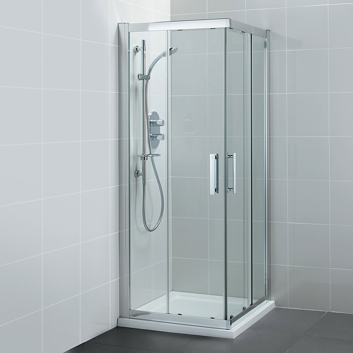 Ideal Standard Synergy sliding corner shower enclosure with two doors and silver frame, measuring 1000 x 1900mm.