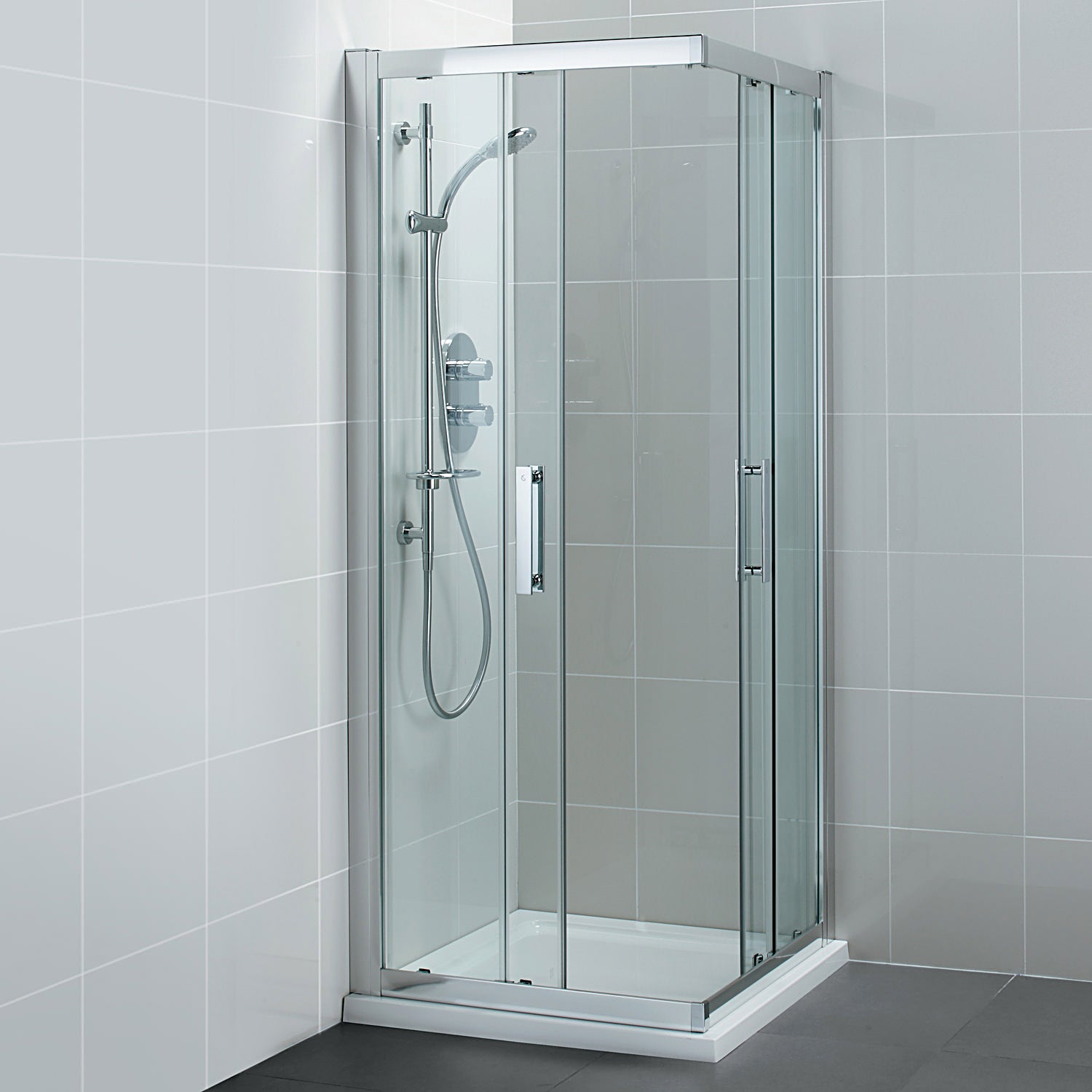 Ideal Standard Synergy corner sliding shower cubicle with silver frame, 800 x 1900mm, featuring clear glass panels and modern design.