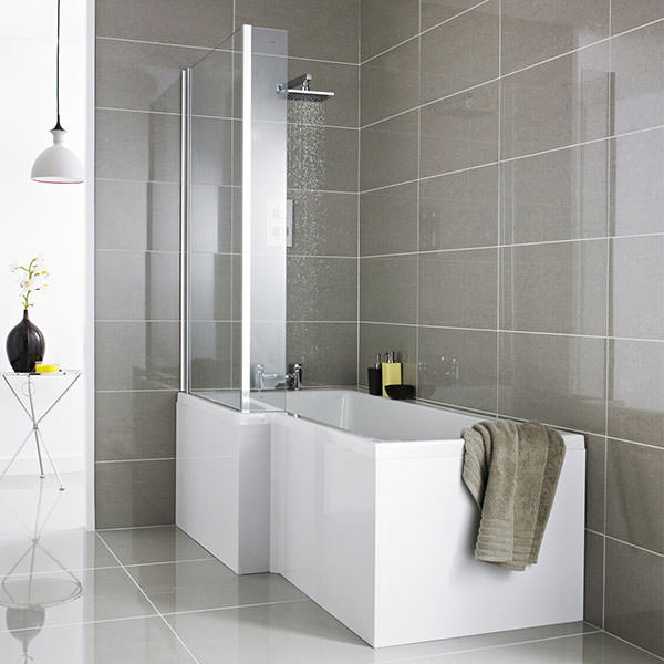 Square white acrylic Nuie L-shaped bath with shower screen and front panel, ideal for modern bathroom setups