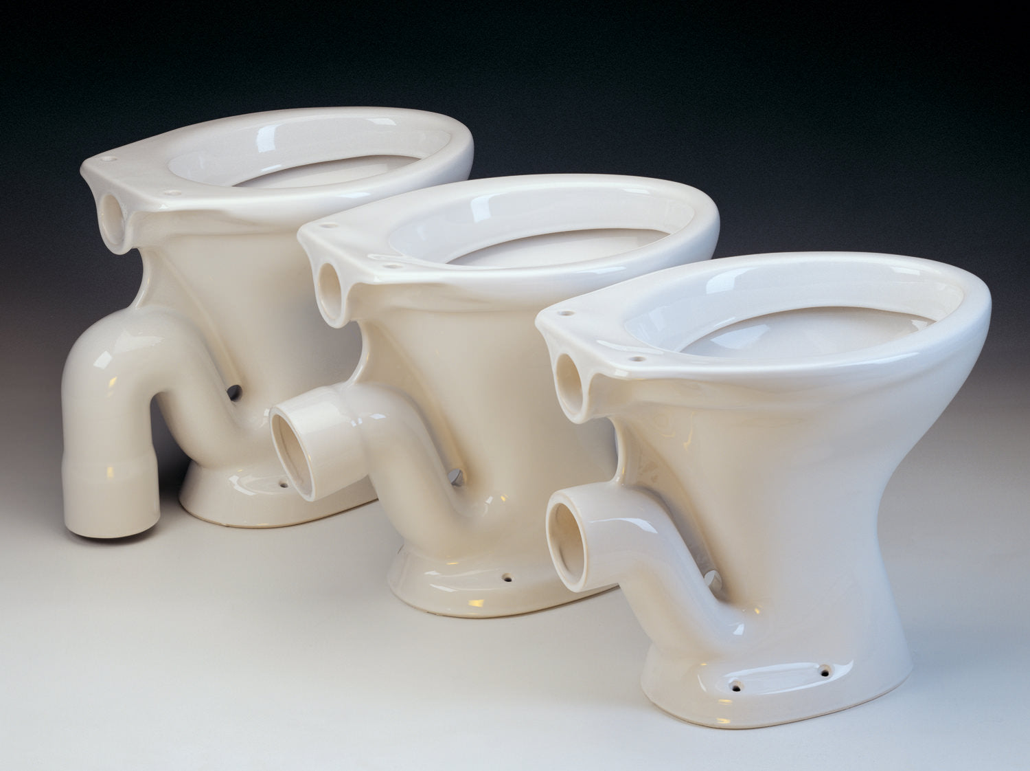 White Wyford Classic Low Level WC Pan by Tuskan Tiles, open back design, measuring 355 x 455mm.
