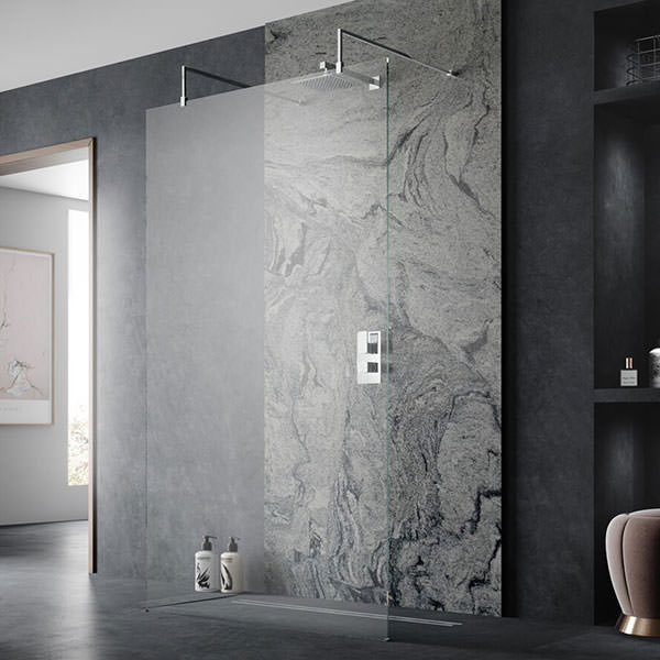 Hudson Reed frameless wetroom shower screen with chrome support arms and feet, 1950mm high, for modern walk-in shower enclosure.