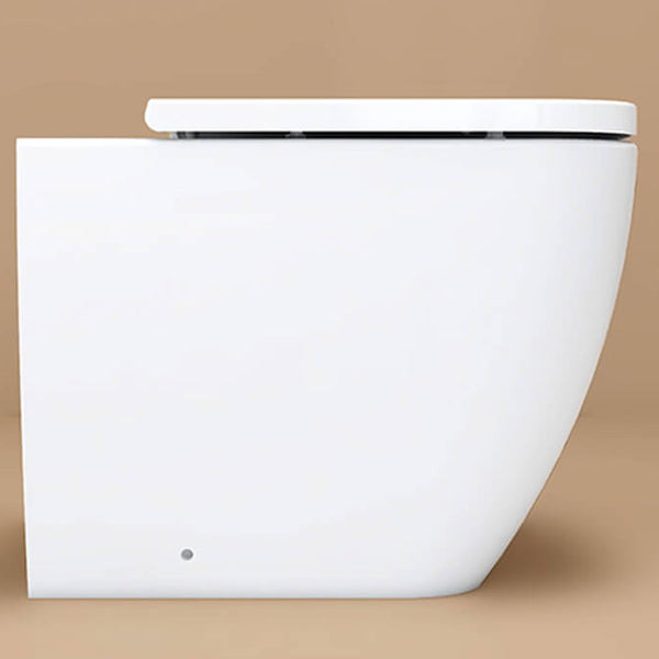 Contemporary white back-to-wall WC pan with seat by IMEX Essence, 520mm, shown in a bathroom setting