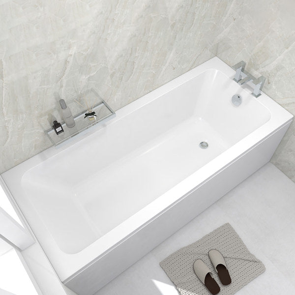 White IMEX Quadro single-ended bath by Tuskan Tiles, 1300 x 700mm with matching leg set, shown from side view.