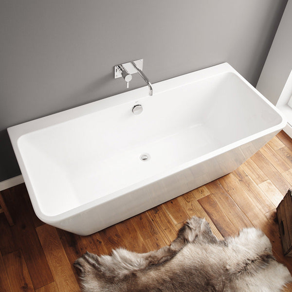 White freestanding contemporary back-to-wall bath by April Eppleby, 1700x750mm, perfect for modern bathroom designs.