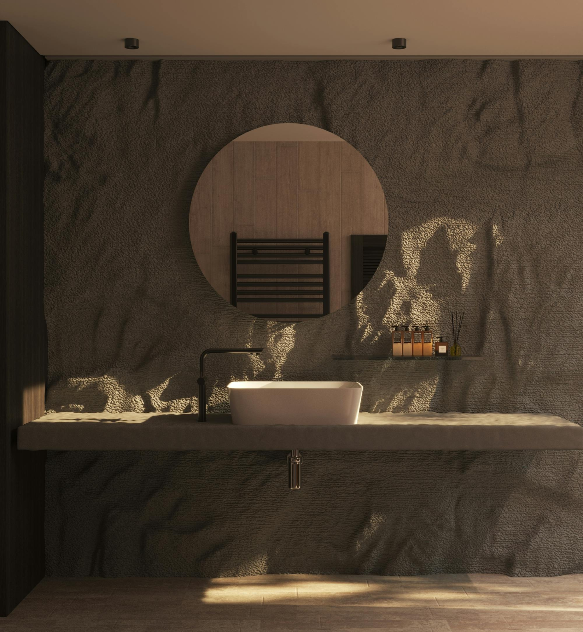 Modern bathroom with a round mirror, black faucet, and stone wall.